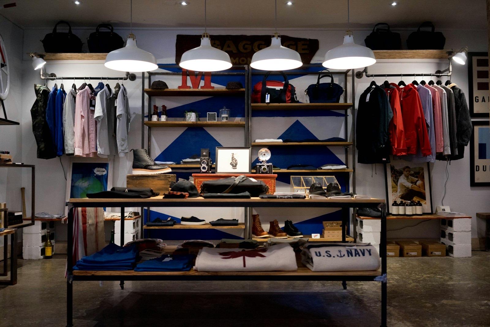 Styled retail boutique interior with pendant lighting and display shelving